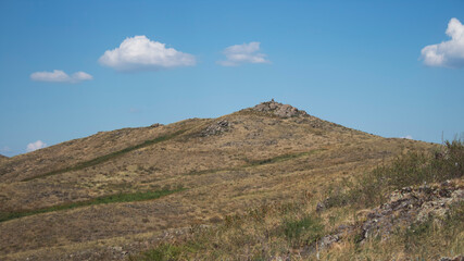 Hills and sky. Summer landscape. Steppe background.