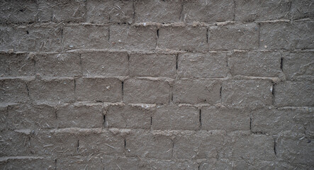 old Clay and straw bricks used for the construction of ecological houses