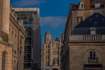 Street view of Église Saint Michel de Dijon, at sunset.
