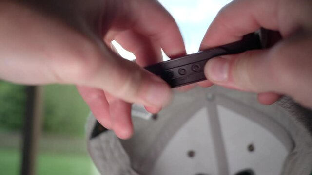 Adjusting the size of a ball cap it fit a larger head - close up