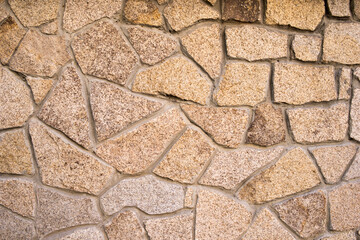 Obraz premium The texture of the stone masonry. External part of the stone structure, architecture.