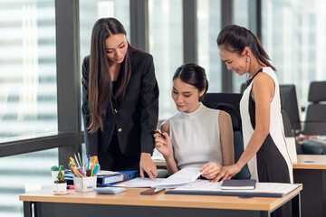 Young Asian Businesspeople working in the office, meeting to discussing business plan, Power of cooperation