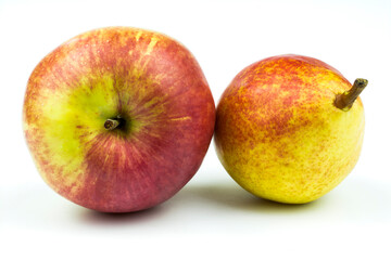 Ripe apple and pear of yellow-pink color isolated on white background.