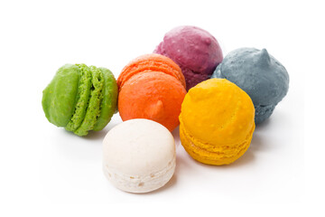 Pile of colorful meringue cookies isolated on white