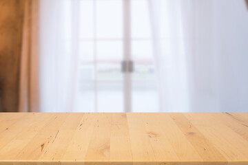 wood countertop with clean and clear room with curtain background