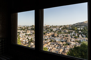 Fototapeta na wymiar Albayzin district of Granada, Spain, from a window in the Alhambra palace