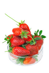 Group of fresh strawberries in the transparent bowl