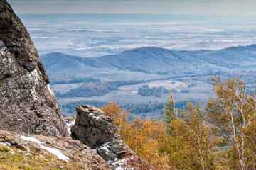 Rock, mountains and autumn forest