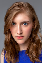 Fototapeta premium Close-up portrait of young woman with perfect skin clean with a red reflex in the face