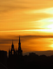 Cathedral and church forming silhouettes at sunset