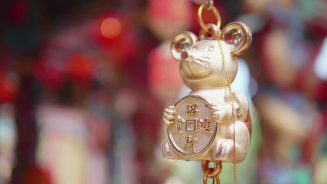 The mobile of the rat year. The Chinese symbol of lucky life or the feng shui symbol in the Chinese shrine or Chinese temple. The meaning of the words are the rich or good luck in money and happiness.