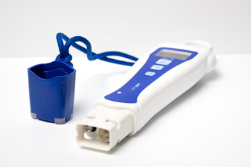 Closeup of a digital pH measuring device. Laboratory equipment for fluid testing.