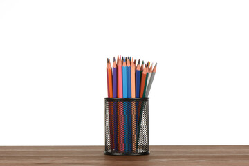 Fototapeta premium Lapiceros de colores en un bote en la mesa