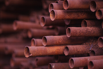 Metal pipes from a sugar plant stacked together.