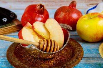 A jewish new year with honey for the apple and pomegranate holiday of Rosh Ha Shana