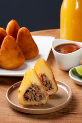 .Ground beef coxinha. Appetizer of Brazilian cuisine served in bars and parties