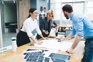 Colleagues discussing charts and diagrams