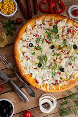 Traditional pizza pepperoni, assorted sausage, olives, arugula, corn, mozzarella