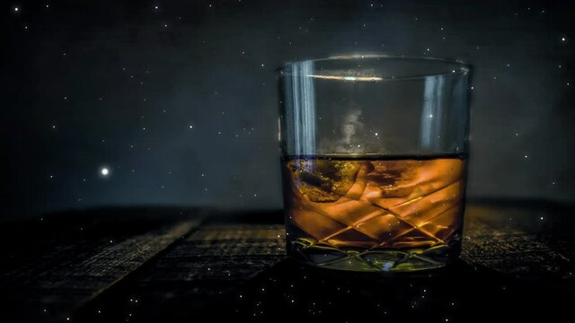 Video of a glass having alcohol in it as camera zooms in
