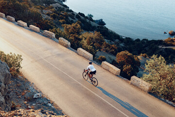 Cyclist riding on his bicycle at coastal road