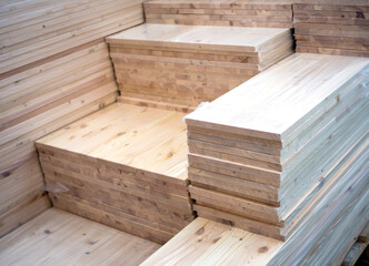 Stacks of wooden boards of various sizes
