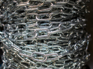A metal chain wound in a small coil