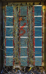 messy net of cables from an abandoned electrical circuit - steampunk background