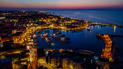 Aerial view of the port of Bisceglie at night - Historic marina in the south of Italy, in the region of Apulia, near the Adriatic Sea