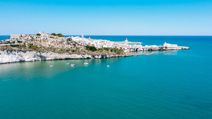 Fototapeta premium Aerial view of Vieste on the Gargano Peninsula in Italy - Narrow peninsula with white houses built on a hilltop over the Adriatic Sea