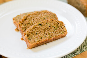 Slices of delicious and sweet Zucchini Bread on a White Plate