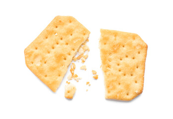 Broken delicious crispy cracker isolated on white, top view