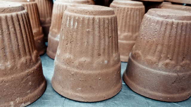 Image of cups made of mud or sand called kulhad/kullhad used to serve authentic indian drinks called lassie/lassi, milk, tea.