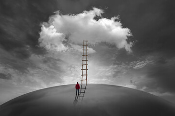 Man in front of a cloud with a wooden ladder - obrazy, fototapety, plakaty