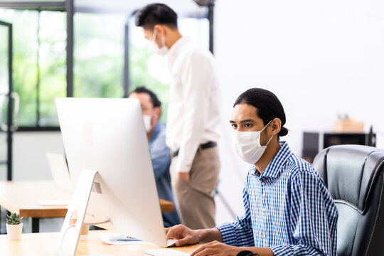 Asain Employee Face Mask In New Normal Office