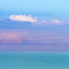 Relaxing seascape with horizon, blue sky and sea at sunrise. Summer vacation concept.