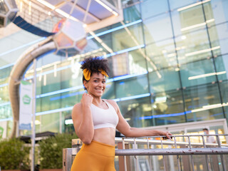 young afro girl with strong and happy sportswear