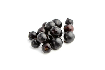 Ripe black currant berries isolated on white background