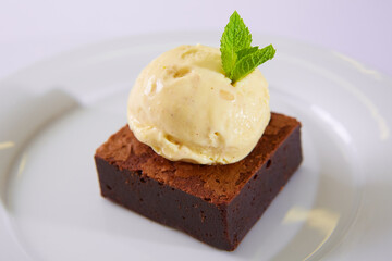 Chocolate Brownie with Vanilla Ice Cream. Shallow dof.
