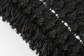 multicolored jacquard fabric made of black and white threads, texture, background