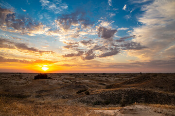 Fototapeta na wymiar Beautiful morning desert landscape at sunrise with dunes.