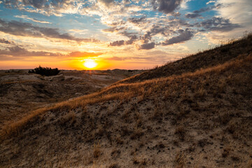 Beautiful morning desert landscape at sunrise with dunes.