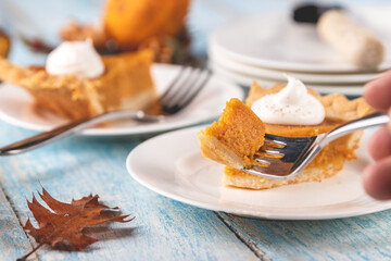 Bite of pumpkin pie on a fork