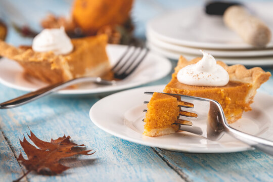 Cutting into a slice of pumpkin pie
