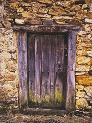Antique wooden barn door without paint