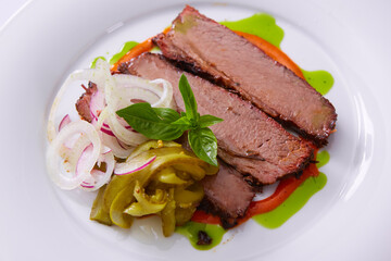 Beef Brisket Classic Texas Smoked BBQ Traditional Texas Smoke House Beef Brisket barbecue. Rubbed with spiced and slow smoked in a classic Texas smoke house over mesquite wood chips in smokehouse.