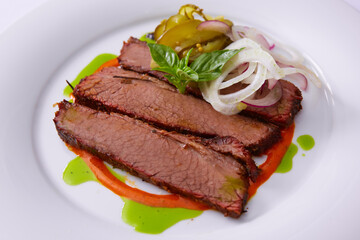 Beef Brisket Classic Texas Smoked BBQ Traditional Texas Smoke House Beef Brisket barbecue. Rubbed with spiced and slow smoked in a classic Texas smoke house over mesquite wood chips in smokehouse.