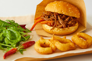 Sweet bun barbecue beef brisket with watercress leaves. Whisky barrel chip smoked British beef brisket with smoky barbecue sauce