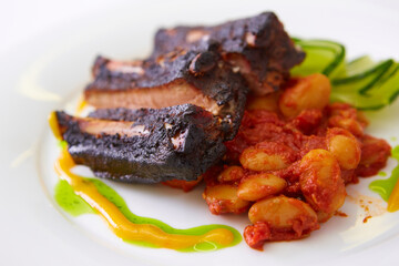Barbecued pork ribs and baked beans. Shallow dof.