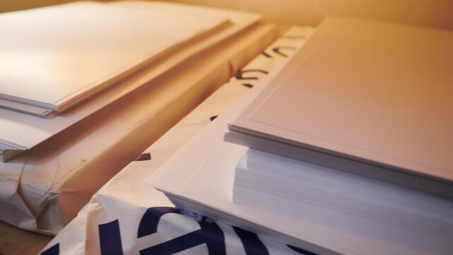 Close-up of large stacks of clean white paper. Stock footage. Stocks of high-quality clean paper for office printouts and documents. Blank paper for printing