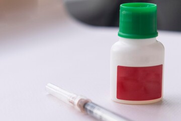 Vaccine vial and syringe, vaccination  and immunity improvement concept.  